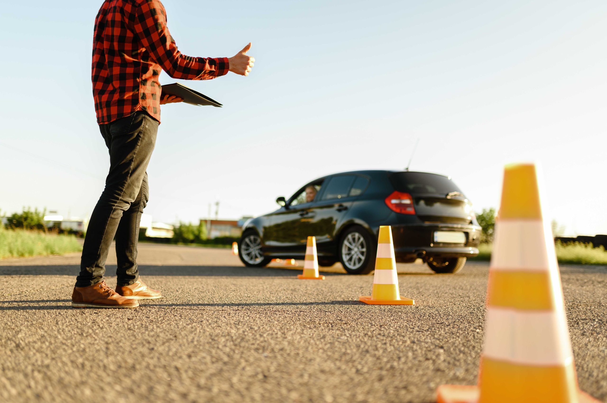 instructor helps student to drives between cones 2023 11 27 05 32 26 utc scaled